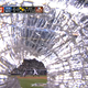 TV Cameraman Keeps Filming After A Baseball Bat Smacks His Gear